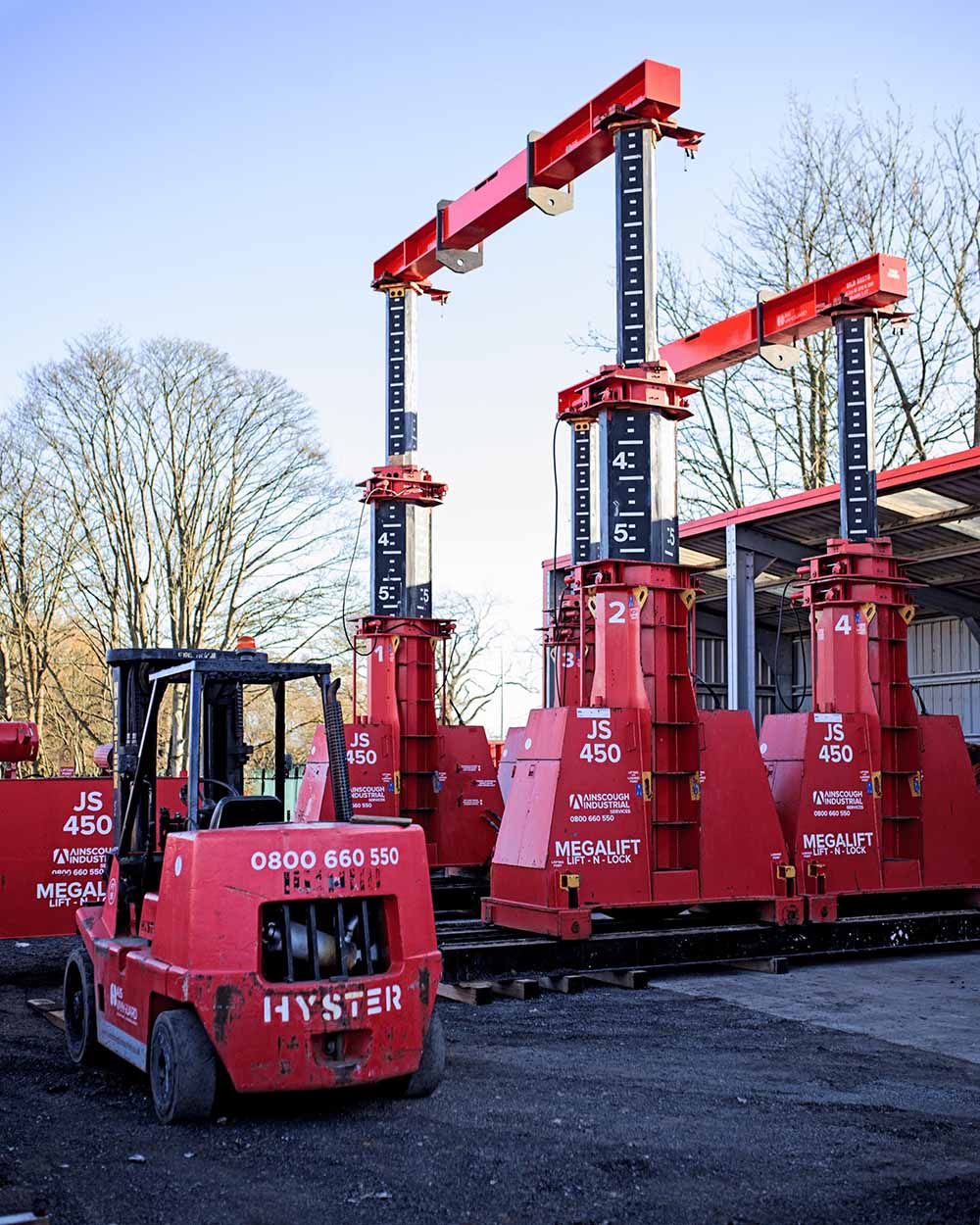 Vanguard Industrial Group team actively managing heavy equipment transportation.