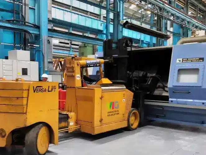 Heavy machinery moving and installation project case study for factory relocation.