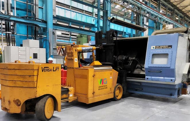 Heavy machinery moving operations featured in an industrial relocation blog post.